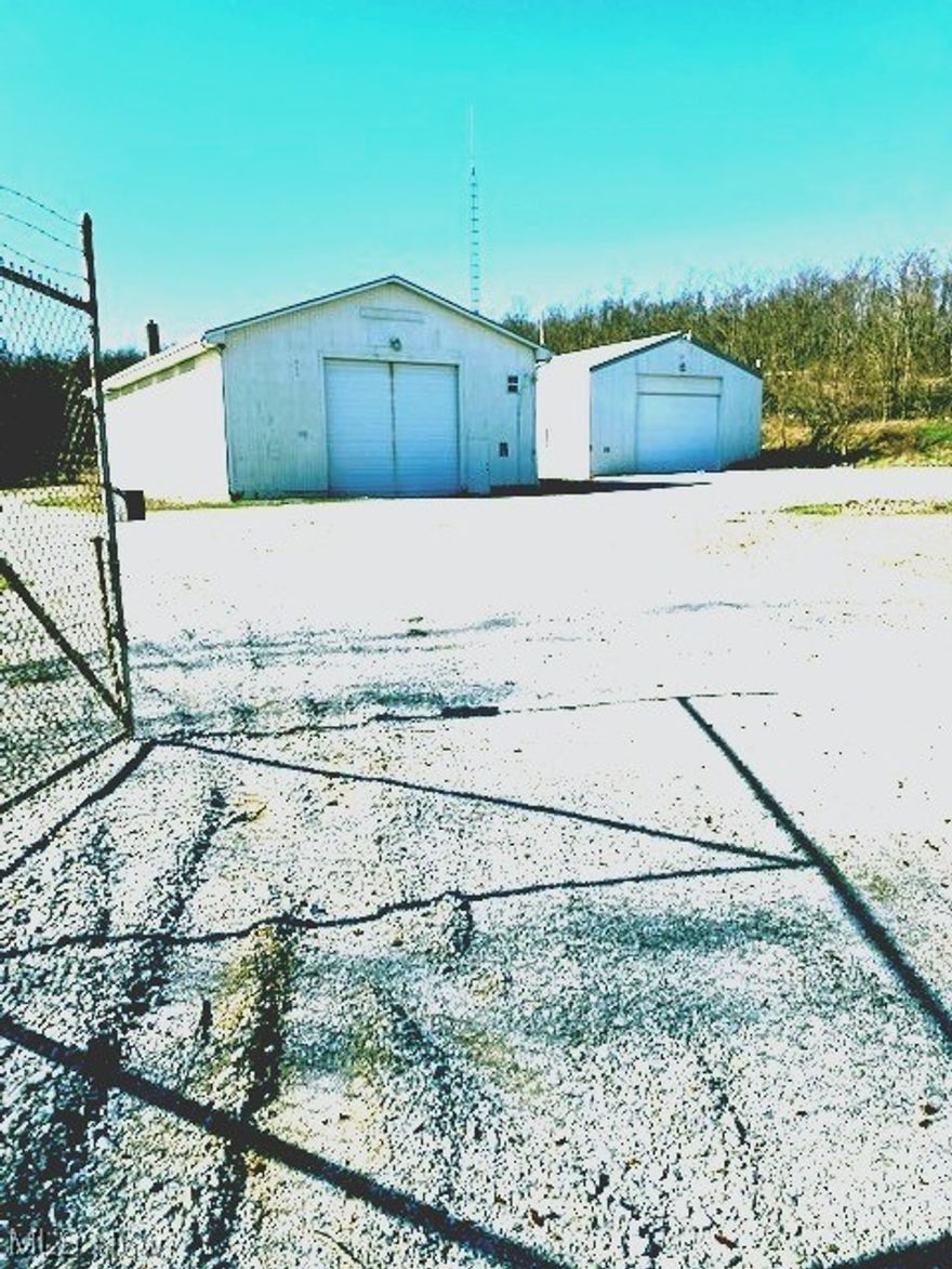 St.Clairsville Commercial Property Available!  This 1.7 Acre site consists of 2 Pole Buildings each containing a 1 Bedroom living quarters or office/w restroom.
 The 42x80 Metal Building has 3360 sq. ft. w/18x16 overhead door one at each end so capable of drive thru. The Main door is automatic with opener for easy 
 access in any weather.  The 40x50 Metal Building is 2000 sq. ft. part warehouse/garage and also there is a 1 bedroom apartment with kitchen, main living area 
 has a winding staircase going to a large bedroom, walk-in closet and very nice bath. Both buildings have concrete garage areas and they are surrounded by an 
 8 ft. security fence with a 30 ft. wide gate. The property has county water, electric and septic.  Endless possibilities: storage, warehousing, small business or 
 possible dog kennel.  Qualified buyers only!