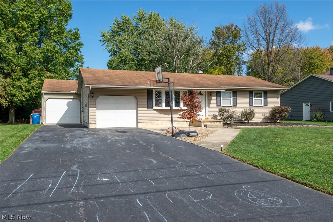 Well kept ranch with hardwood floors throughout bedrooms and living room. Nice kitchen and bath. Lots of extra space in the finished basement that has a rec room, playroom, bedroom, and extra full bath - along with a utility/laundry area. The outside has so much to offer including a second garage that is attached with a covered walkway, firepit, deck, and swimming pool, and lots of room to spread out. Come see for yourself!