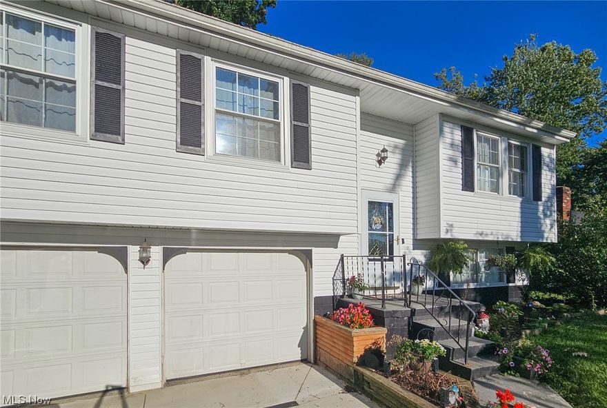 SPECTACULAR, MOVE-IN-READY home in Newton Falls!   The main floor features a spacious living room, 3 bedrooms with double closets, beautifully updated full bath with custom detailed tile and brushed fixtures, eat-in kitchen with Kraftmaid cabinets and stainless steel appliances. Sliding glass doors from dining area give access to a 12x12 deck, overlooking a huge backyard that's wooded beyond the property. Nature, privacy and peace, right out your back door! The lower level is lined with warm cedar walls, barn doors, custom shelves, detailed cedar accents, recessed lighting, drop down ceiling and separate storage room/closet. Great for family room rec room, home office, guest room... options are endless! Utility room with toilet and extra storage. Attached 2 car garage, pull down attic access, and shed underneath deck. Updates include 
Furnace and Hot water tank (2019), AC (2023), newer 200amp electrical service, garbage disposal (2020), metal roof (2013), new concrete driveway and drainage (2022), fresh paint and new fixtures. Step in and feel right at home- A MUST-SEE!  Schedule your showing today!