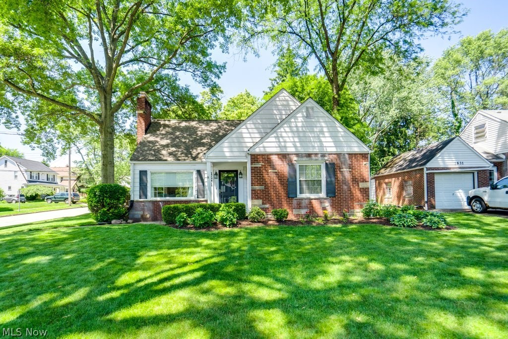 Darling crisp white cape cod-home, offset with attractive brick accents, situated in a quaint tree-lined neighborhood in the heart of Cuyahoga Falls minutes away from everything you love! The city’s Quirk Cultural Center, offering multi-age activities, a mid-summer Farmers Market and a Craft Shoppe filled with handmade treasures. This home is a five minute drive to everything you love in Downtown Cuyahoga Falls as well! Restaurants, Breweries, local shops, speakeasies, and kid friendly festivals throughout the summer! A kitchen with raised panel cherry cabinetry, gleaming granite counters, ceramic tiled backsplash and new appliances (Range, dishwasher, refrigerator, and range exhaust hood in 2024). Main level boasts refinished wood flooring in the dining and fire-placed family room areas, extending into the two first floor bedrooms. An updated full bath and convenient mudroom/breezeway leading to the attached two-car garage complete the first floor. The second floor contains the private master suite with a large walk-in closet and updated in 2020, ceramic-floored full bath with tiled shower. There’s an abundance of natural light thanks to numerous windows. A full basement accommodates storage needs. Furnace/ AC updated in 2020. Enjoy summertime in the lovely landscaped and fenced backyard, featuring a large paver patio. Make this home yours today!