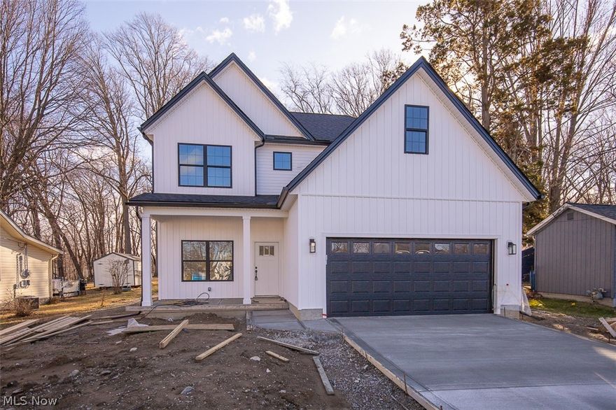 5595 Walnut St, Mentor-on-the-Lake — Stunning new-construction home, move-in ready.

Step inside to bright, open living with 9' ceilings on the main floor, luxury vinyl plank flooring, and abundant natural light. The kitchen features crisp white soft-close cabinets, quartz countertops, and a welcoming layout perfect for entertaining. A convenient main-level half bath and a locker/bench storage area off the garage add everyday functionality.

Upstairs offers three bedrooms, including a master suite with a full bath and walk-in shower. An additional full bath with a one-piece tub/shower and an upstairs laundry room provide practical convenience. Bedrooms and hallway are carpeted; bathrooms and laundry are finished in LVP. Upstairs also has a additional bonus room above the garage great for a playroom/office. 

Outside, enjoy a sizable rear yard and a updated  shed for additional stowage . The property includes a concrete driveway, city water and sewer, and a quiet, desirable street location. 

This home comes with a 1-year builder’s warranty. Schedule a showing today.