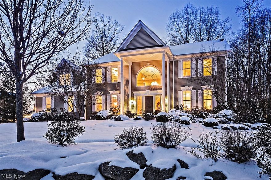 Live with prestige in this stunning colonial in Canyon Lakes, the most sought-after neighborhood in Chagrin Falls! With over 4,000 square feet of living space, a luxurious owner’s suite, and a fabulous back deck and yard, this Bainbridge beauty is ready for a new owner. Step inside the foyer, where curved archways flow to a sitting room on the right and the formal dining room on the left. The kitchen showcases stainless steel appliances, granite counters, and an eat-in area with deck access. Off the kitchen, the vaulted great room features a floor-to-ceiling stone fireplace and a wall of windows that frames the gorgeous natural setting. A laundry room, a half bath, and a study with a fireplace complete the first floor. Upstairs, the vaulted master bedroom suite includes a walk-in closet, a bonus space that is perfect for an exercise room or dressing room, and a spa like bathroom. Two bedrooms share a jack and jill bath, and the fourth bedroom enjoys its own en-suite.  The full lower le