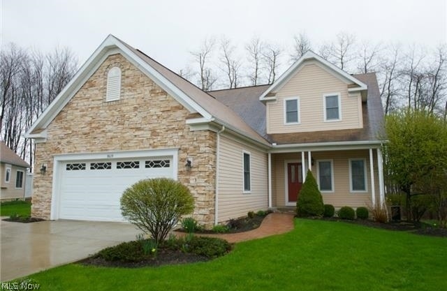 With 4,140 square feet of total living space, this beautiful free-standing cluster home in Macedonia’s prestigious Villas of Tuscany is a gem. A former model home, its private wooded cul-de-sac setting borders both Hudson and Twinsburg. Priced below appraised value! Purchased as the model then added Sun Room, deck and an additional 1,400 square ft in the beautifully finished lower level. Highest quality construction with every upgrade including hardwood floors, custom moldings, 9' ceilings, upgraded carpet and finishes, all on a premium lot. Vaulted ceiling in the great room with skylights and gas fireplace. Adjoining formal dining room flows right into the sunroom overlooking the woods. Gourmet kitchen with custom cabinetry, GE Profile appliances and Corian Countertops. The bayed nook is a perfect spot for breakfast. Beautiful open staircase leads to second floor loft with custom built-ins, two generous sized bedrooms and a full bath. Spacious first floor Master and Master Bath offers