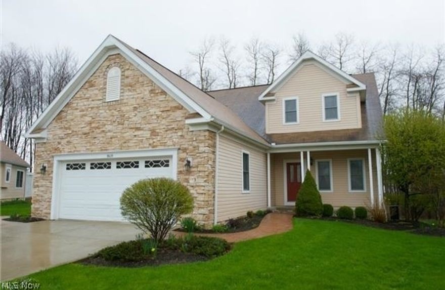 With 4,140 square feet of total living space, this beautiful free-standing cluster home in Macedonia’s prestigious Villas of Tuscany is a gem. A former model home, its private wooded cul-de-sac setting borders both Hudson and Twinsburg. Priced below appraised value! Purchased as the model then added Sun Room, deck and an additional 1,400 square ft in the beautifully finished lower level. Highest quality construction with every upgrade including hardwood floors, custom moldings, 9' ceilings, upgraded carpet and finishes, all on a premium lot. Vaulted ceiling in the great room with skylights and gas fireplace. Adjoining formal dining room flows right into the sunroom overlooking the woods. Gourmet kitchen with custom cabinetry, GE Profile appliances and Corian Countertops. The bayed nook is a perfect spot for breakfast. Beautiful open staircase leads to second floor loft with custom built-ins, two generous sized bedrooms and a full bath. Spacious first floor Master and Master Bath offers