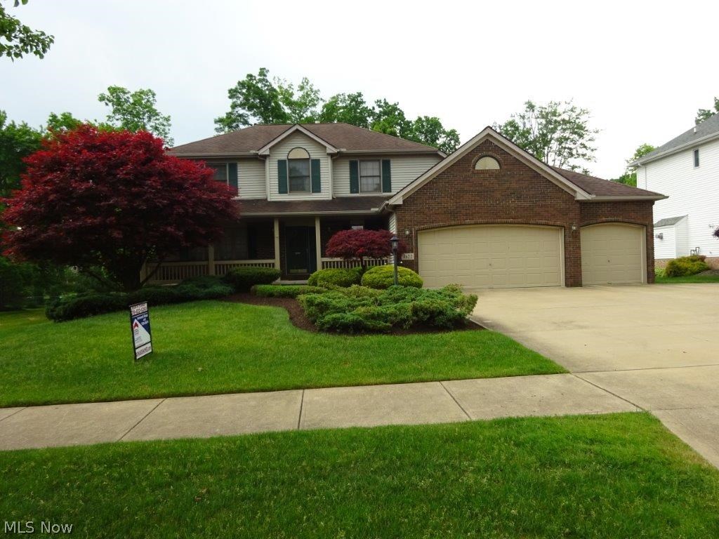 Stunning 4 bedroom, 2.5 bath Colonial in Seven Hills. Beautifully maintained with front porch. Great curb appeal, park-like setting on dead end street. Newer ceramic title in foyer. Kitchen has large eat-in area, double ovens, center island and lots of cabinets, open to family room with custom built-in book cases, sliding door leading to spectacular brick paver patio & shed. Hickory cabinets throughout. Ceramic floors in foyer, kitchen, laundry room and baths. Formal living room & dining room (with crown molding & trayed ceiling. 4 larger bedrooms, master bath. Walk-in closet in master bedroom and one other bedroom. First floor laundry room with pantry & loads of storage. 3 car attached garage & driveway (oversized). Early occupancy. America's Preferred Home Warranty!