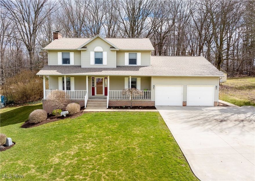 This stunning two-story Colonial in Jackson offers the perfect blend of classic charm and modern convenience, featuring four spacious bedrooms and two and a half baths. A large front porch welcomes you home, overlooking a beautifully landscaped front yard and plenty of space to enjoy the outdoors. Inside, the foyer includes a sizable closet for added storage. Just off the entrance, a dining room provides a setting for formal gatherings. The expansive great room is bathed in natural light from numerous windows and features a striking brick facade gas fireplace, creating a warm and inviting atmosphere. The eat-in kitchen is the perfect space to entertain, boasting a beautiful stone backsplash, a large mobile island, abundant cabinetry, multiple pantries, and generous counter space. A conveniently located half bath and a laundry room with built-in cabinets and a utility sink sit just across from the tandem three-car garage. Upstairs, the luxurious master suite offers a retreat-like atmosphere, while the ensuite bath impresses with a garden tub, a dual sink vanity, a spacious walk-in shower, and a 4x9 walk-in closet. Three additional bedrooms offer ample closet space and a second full bath features a vanity sink and a shower-tub combo for added convenience. The finished basement offers two versatile rooms and a large entertainment area featuring a cozy corner fireplace. A dedicated utility room ensures plenty of storage and workspace. The backyard is a private, wooded retreat, featuring a spacious back deck that steps down onto a cement pad, ideal for gatherings or relaxing in nature. With a home warranty included for the buyer’s peace of mind, this exceptional home is a must-see!