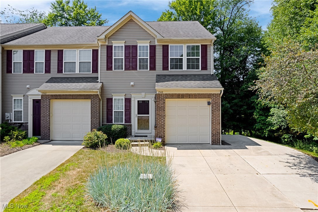 This hidden gem is nestled along the picturesque fairways of Brookledge Golf Club—one of Ohio’s premier public courses. The rowhome-style condo offers over 2,100 square feet of elegant, light-filled living space where sophistication meets serenity. Built in 2009 and still feels like new, this meticulously maintained 3-bedroom, 4-bath home is move-in ready. From rich hardwood floors to fresh carpeting, every surface reflects comfort and style. Neutral tones highlight the abundant natural light, accentuating the 9-foot ceilings and soundproofed construction. The main floor is thoughtfully designed for both comfort and entertaining, with an open-concept layout that seamlessly connects the living room, dining area, and kitchen. A cheerful sunroom just off the living space offers the perfect place to enjoy morning coffee or unwind while taking in the wooded backyard views. Upstairs, the spacious primary suite is a relaxing retreat, featuring a generous walk-in closet and a private en suite bath. Two additional bedrooms share a full bath, and the upstairs laundry closet adds everyday convenience. The fully finished walk-out lower level enhances your living space with a large family room, a flexible area for a home office or creative space, a half bath, and a storage closet. Sliding glass doors lead to a quiet backyard framed by mature trees and visited often by local wildlife. The lot itself offers both charm and function, witha whimsical treehouse feel , the option to add a deck, and the peace of a private, dead-end street. Located in a welcoming neighborhood with scenic lakes and ponds, you’re just minutes from Route 8, shopping, dining, and all that Cuyahoga Falls has to offer. Highlights include a new hot water tank (2021), a recently serviced furnace, a basement sump pump, and hardwired carbon monoxide and smoke detectors. Every detail has been carefully maintained, making this a rare opportunity to enjoy low-maintenance living in a truly idyllic setting.