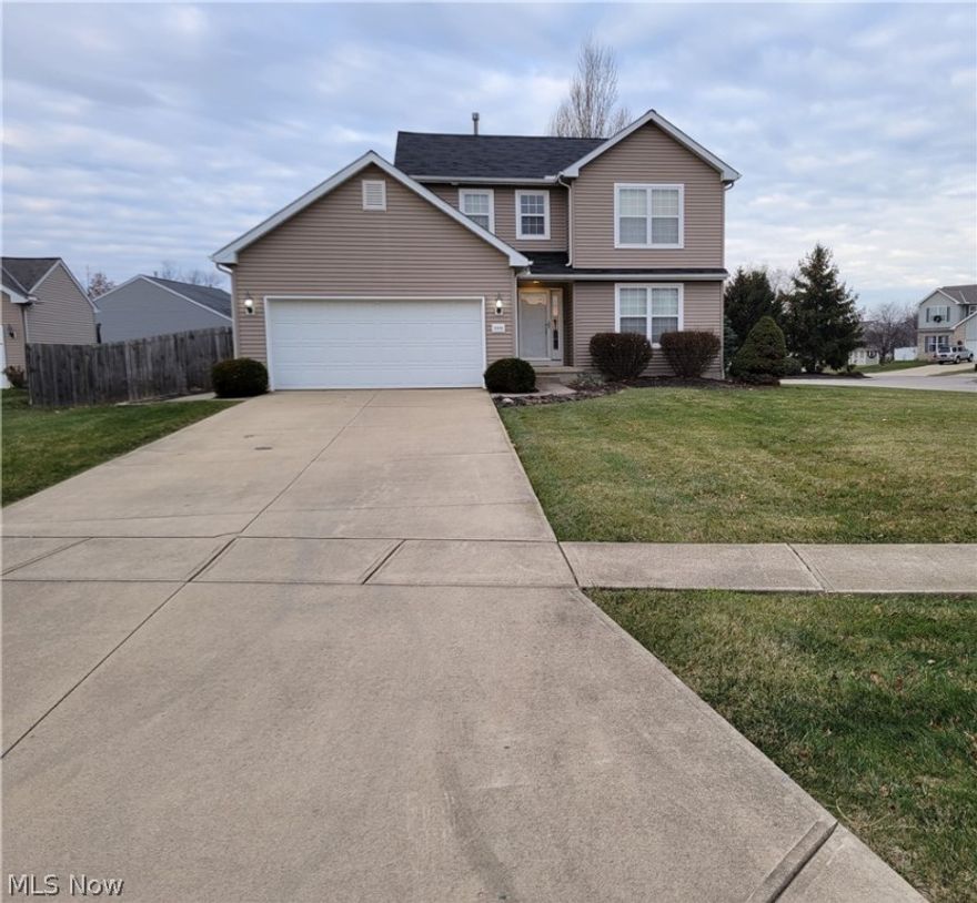 Check out this Oster Construction quality-built home! Situated on a large almost 1/3 acre fenced corner lot this home has a lot to offer. Wooden deck with composite railings leads to 2 patios. Plenty of space to enjoy the outdoors. Matching 10x16 outbuilding provides ample storage space to free up the 2-car garage. Pull down stairs in garage allows access to overhead attic storage. The covered porch protects the entry door from the elements. As you enter the home you are greeted by the 2-story foyer. Storage abounds in this home with closets strategically placed throughout. Full ceiling height basement with 1/2 bath rough in ready to finish. Quality mechanical systems include a Trane furnace and air conditioner and several year old Bradford White water heater.  Assumable tax abatement thru 2027 tax year will save significant money on property taxes. Includes $5000 seller credit to pick out the flooring of your choice.