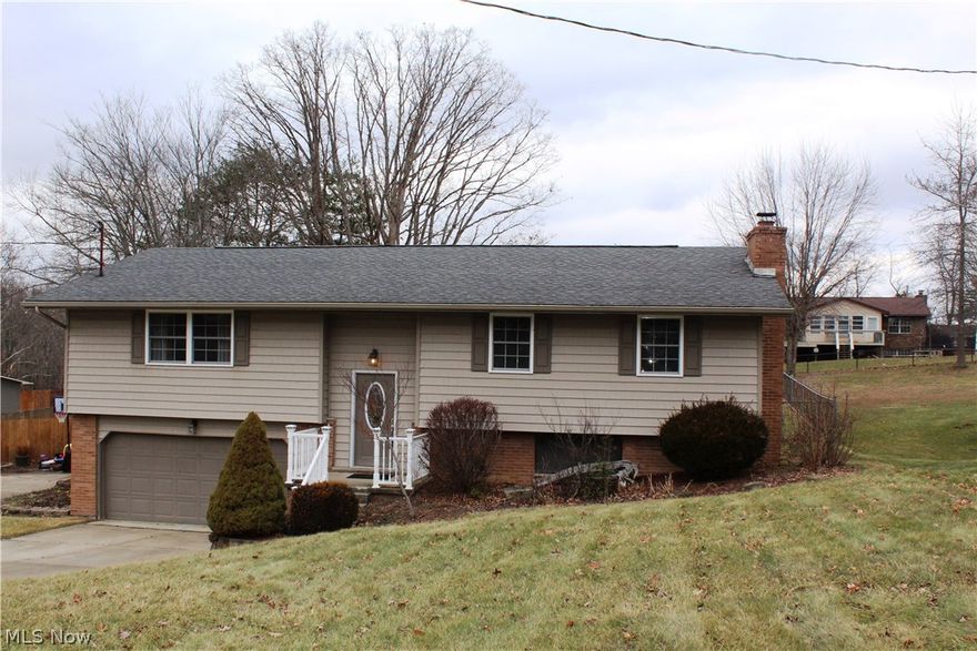 Move-in ready! Fabulous 4 bedroom, 3 Full bath home featuring spacious kitchen, large living room with gorgeous hardwood floors, huge recreation room with wood burning fireplace, over-sized back deck, fenced yard & 2-car garage.