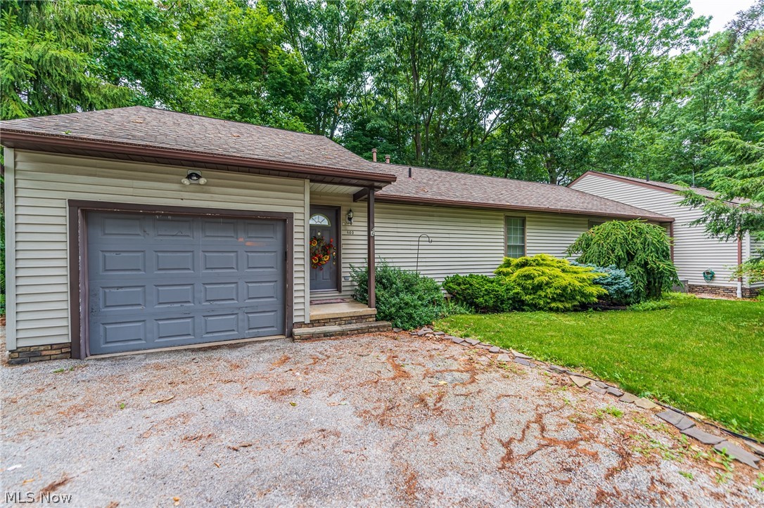 Beautifully maintained ranch duplex located in a private wooded oasis with a relaxing creek running through the property. This flag lot allows both units to enjoy the privacy and quiet of being away from the road and in the middle of nature. Each unit is well taken care of with one side previously owner occupied. Both units have a private screened in porch with full basements. Larger unit has a beautiful custom built gas fireplace, full kitchen with dine-in area, laundry on the main floor and an additional full kitchen in the basement with bonus room full bathroom! Storage galore in both sides with an additional storage shed outside. This one will not last, come take a look!