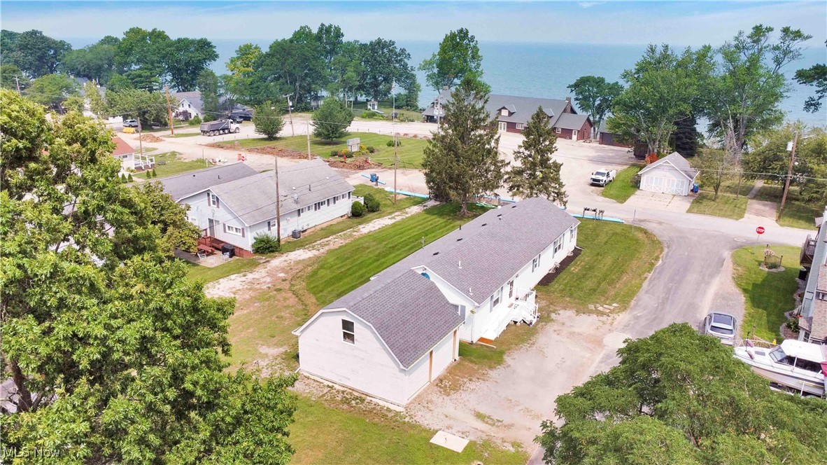 Welcome to 3753 Edgewater Dr in beautiful Vermilion, OH — a charming 3-bedroom, 2-bath ranch-style home boasting stunning Lake Erie views. This inviting single-story residence offers approximately 1,900 square feet of comfortable living space, thoughtfully designed with a spacious living room, cozy dining area, and a bright kitchen perfect for everyday living and entertaining. Enjoy relaxing in the sunroom or step outside to the deck overlooking the peaceful waters of Lake Erie. The finished partial basement adds versatile space for recreation or an office. Nestled on a 0.21-acre corner lot on a quiet street, this home provides easy access to Vermilion’s parks and community amenities. Experience year-round comfort with central air and forced-air gas heating. With a detached storage shed and ample outdoor space, this property is your perfect Lake Erie retreat. Schedule your private showing today and start living the lake life!