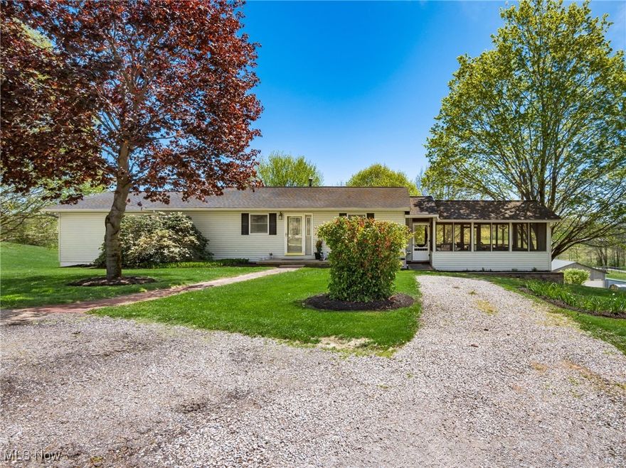 Discover the ultimate in country living with this meticulously maintained 12.17-acre retreat, offering endless possibilities for relaxation, entertainment, and hobby farming. The inviting ranch-style home features an open-concept eat-in kitchen with beautiful granite countertops, a sun-drenched living room with oversized windows, and a luxurious primary suite complete with vaulted ceilings, a walk-in closet, and an en-suite bath. The main floor also boasts a secondary bedroom and an updated full bath, ensuring comfort and convenience for family or guests.

The fully finished lower level provides a huge family room for entertaining, a third bedroom, a full bath, and a versatile space that could serve as a fourth bedroom or a home office. Whether you're hosting movie nights, working from home, or accommodating guests, this lower level adapts effortlessly to your lifestyle.

Step outside to explore the wealth of amenities that make this property truly one-of-a-kind. A 24x48 detached 2-car garage/workshop offers space for vehicles, hobbies, and projects. The 28x64 barn, complete with an attached lean-to, is perfect for housing equipment, livestock, or creating the farm setup of your dreams. The charming chicken coop and vibrant garden area provide everything you need to embrace a sustainable lifestyle.

Savor the flavors of the countryside with established blackberry, blueberry, and raspberry bushes, plus ample space to expand your gardening pursuits. Multiple outdoor spaces, including a serene Florida room, spacious patios, and a screened porch, invite you to unwind while taking in the panoramic views of your private oasis.

This property is further distinguished by its proximity to Interstate 70, offering an ideal blend of tranquil rural charm and convenient access to modern amenities. Additionally, the acreage is thoughtfully laid out to allow for future expansion, whether you dream of adding more outbuildings or cultivating more garden plots.