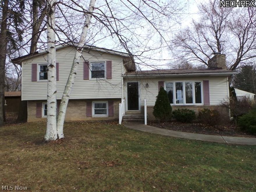 Three, possible four bedroom, split level on almost one acre of land! Wake up and have  a cup of coffee on the covered deck that overlooks huge back yard.  Tons of living space!  Property is HUD owned and sold AS IS.