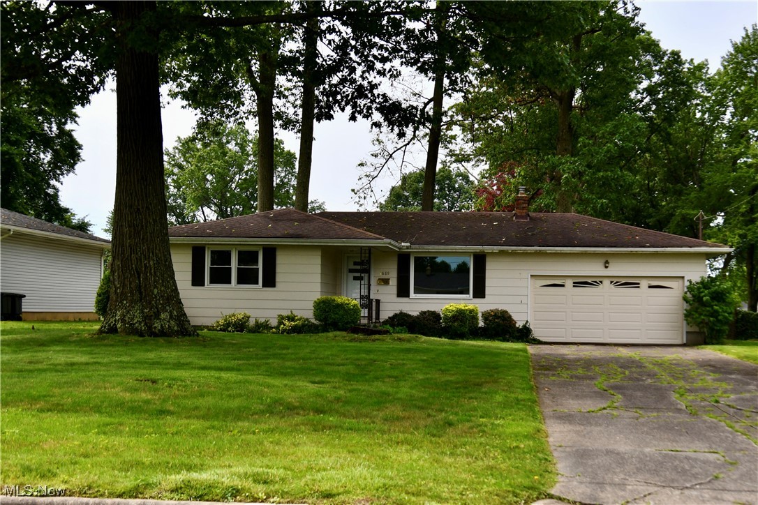 Welcome to this inviting 3-bedroom, 1.5-bath home that perfectly blends classic charm with modern updates. Step inside to find original hardwood floors that add warmth and character throughout the main living areas. The freshly painted interior offers a clean, bright canvas ready for your personal touch. Enjoy everyday meals in the eat-in kitchen featuring a functional peninsula for added counter space and seating. The kitchen opens to a large family room—ideal for relaxing or entertaining—highlighted by a sliding glass door that leads to the shaded backyard. Outdoors, you'll find a concrete patio perfect for summer barbecues and a covered front porch where you can unwind with your morning coffee. The partially fenced backyard is both peaceful and private, trees offer ample shade and room to play or garden. Additional features include a 2-car garage for secure parking and storage and for peace of mind a 2-10 Home Warranty is included—offering coverage on major systems and appliances. Don’t miss the opportunity to make this home your own—schedule a showing today! Basement has been completely waterproofed!