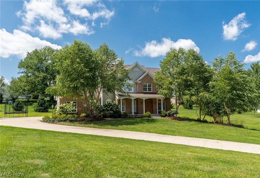 Quality built home that combines spacious living with an intimate feel. Set on almost two meticulously groomed acres, this 3,400 square foot residence boasts 4 bedrooms, 4 baths linked by a second floor walkway. Enjoy a modern, airy, eat-in kitchen with additional counter/bar sitting area, a home office gorgeously finished with cherry wood work, as well as a living room and formal dining area. Entertain with family and friends year round in the fully finished lower level perfect for pool table, games with entertainment console and half bath. Step outside where you'll relax on a huge stone patio with built-in BBQ grill and fireplace, plus a huge wooden portico, with room and space for comfy seating. A charming playhouse on the property can be the perfect for children, and the 3-car attached garage for vehicles, hobbies and storage.This home has an open air quality and versatility to it yet still manages to be welcoming and inviting. Call now to view.