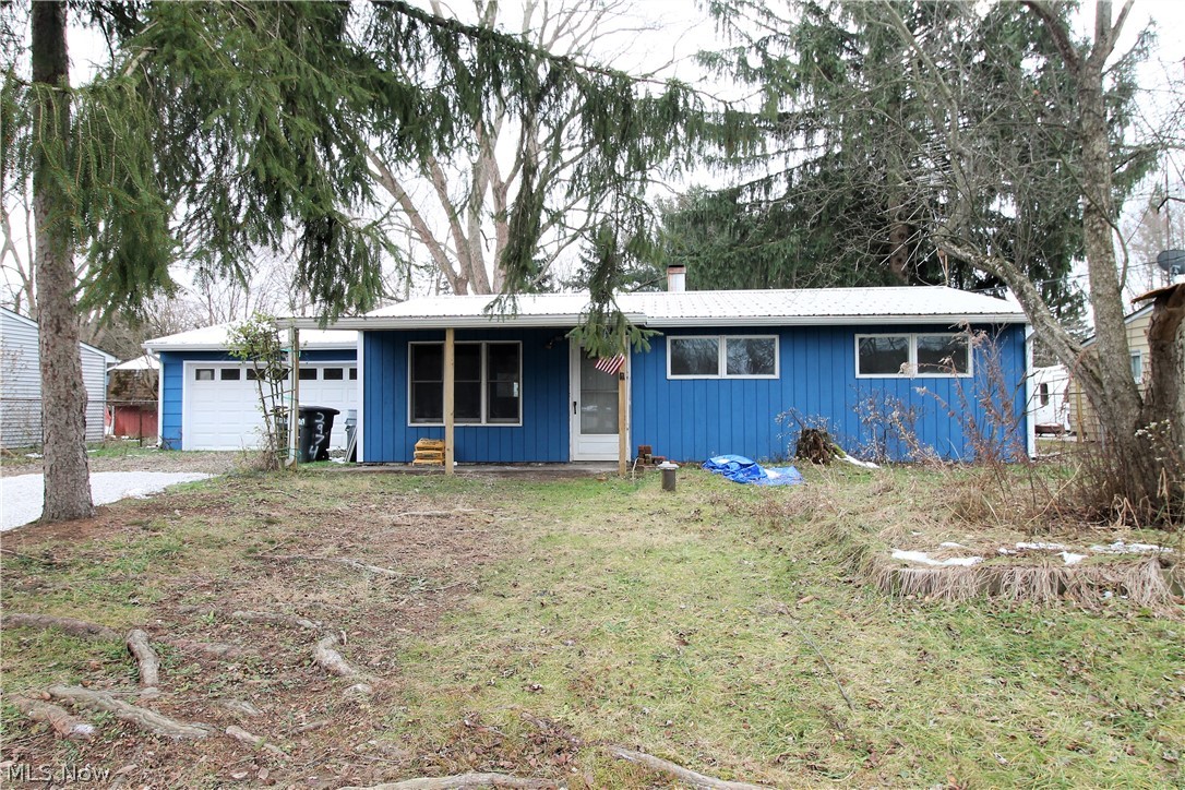 Welcome to this charming three bedroom, one and half bath updated ranch home. Come on in from the covered front porch to the family room which offers newer vinyl flooring and a large window to let the natural light to shine through, the home has new trim throughout. The updated kitchen offers new cabinets, vinyl flooring and sink (2020). There is three bedrooms with new carpet and one full bathroom with all new toilet, sink, flooring and vanity. The half bathroom offering all new toilet, vanity, sink. There is a walk up attic for more storage. The large fenced in backyard has a covered back porch, and plenty of room for entertaining or just relaxing. Two car attached garage with electric. Some more updates include the home has been recently painted inside, new lighting, new thermostat, newer furnace (2018), A/C (2019), new roof (2018), new doors throughout, some of the windows replaced, updated electric, and exterior freshly painted. Everything on one level! Precious memories begin rig