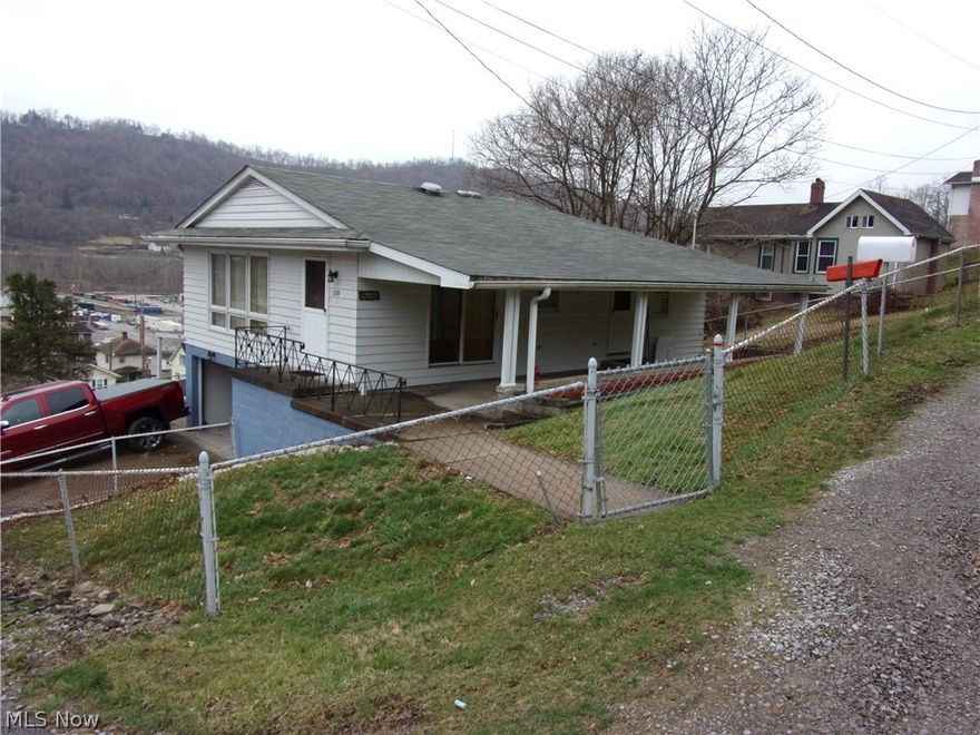 Three Bedroom, one bath ranch, wood burning fireplace, one car garage plus carport, located in Brookside.