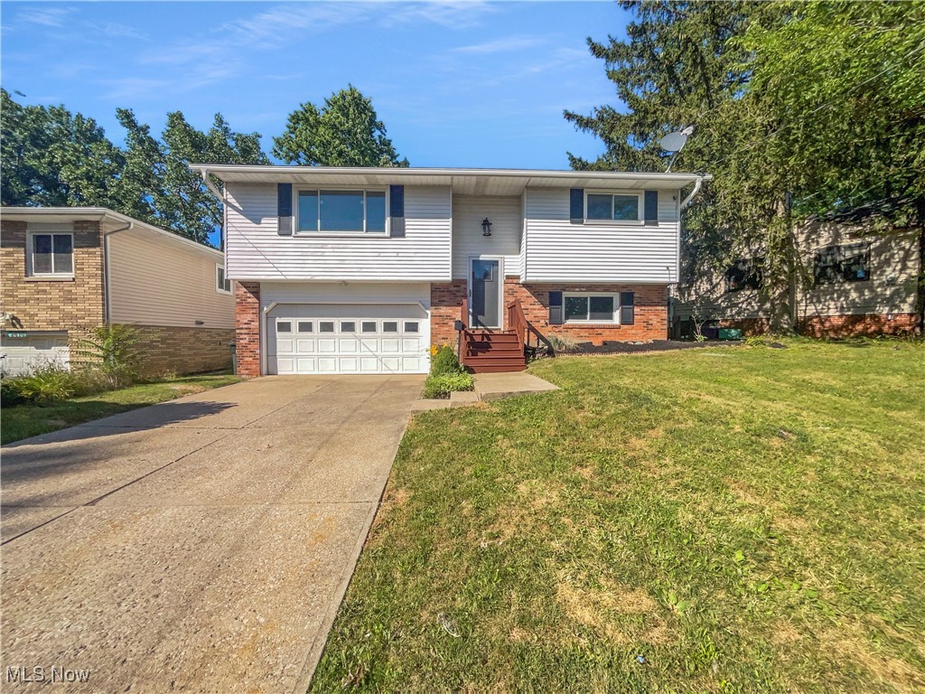 Welcome to this beautifully updated 3-bedroom home featuring a versatile bi-level floor plan and fresh interior paint throughout. Step inside to find updated flooring and newer appliances that bring a modern touch to the light-filled living spaces. The upper level offers comfortable living and dining areas that open to a spacious deck—perfect for outdoor dining and relaxing. The lower level provides additional living space, ideal for a room, home office, or gym. Enjoy the convenience of a 2-car garage and the added bonus of nearby parks and walking trails, offering easy access to outdoor recreation. With thoughtful updates and a great location, this home is ready for you to move in and make it your own!. 100-Day Home Warranty coverage available at closing