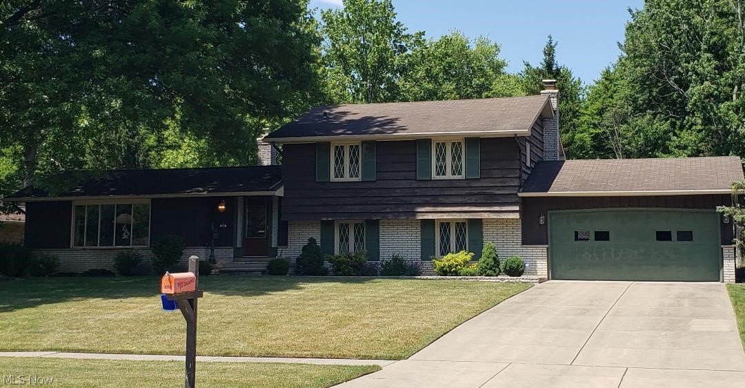 Really - do not hesitate on this one...It is a meticulously maintained 3 bedroom, 2 full bath split level home that features a kitchen with abundant cabinet space, beamed ceiling, eat in kitchen area with ceramic tile! The family room is just the place to relax with the stone woodburning fireplace and wetbar! The dining room features a formal setting that looks into the large beamed ceiling living room that boasts of beautiful wood floors and a wall of windows offering beams of natural light! Oh, did I mention the phenomenal backyard to meet your every need - a porch and paver patio, a large deck for entertaining and a yard that has room to roam! This home boasts of decades of meticulous care and is located on a culdesac street. The backyard backs up to a wooded area that offers privacy that is hard to find! Also offers an attached oversize garage with finished floor and the yard features a sprinkler system. Make your appointment now because this will not last!