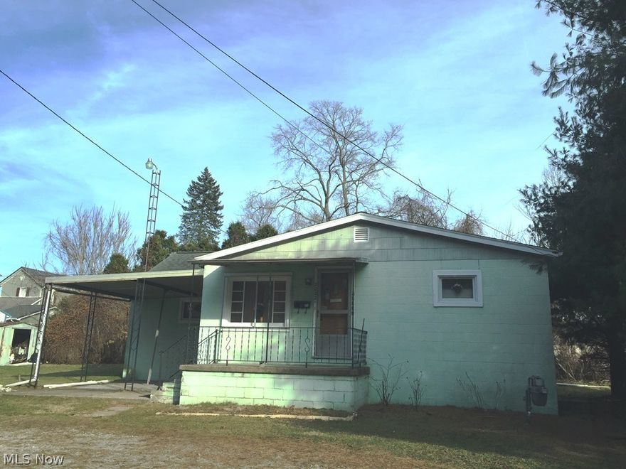 Double lot, large garage, open living room and dining room area, large kitchen fully applianced kitchen with washer and dryer on first floor. Large master bedroom with double closets. Over size huge garage on separate lot great work shop area. Secluded lot home tucked away by pine trees. So much potential here. Selling as is.