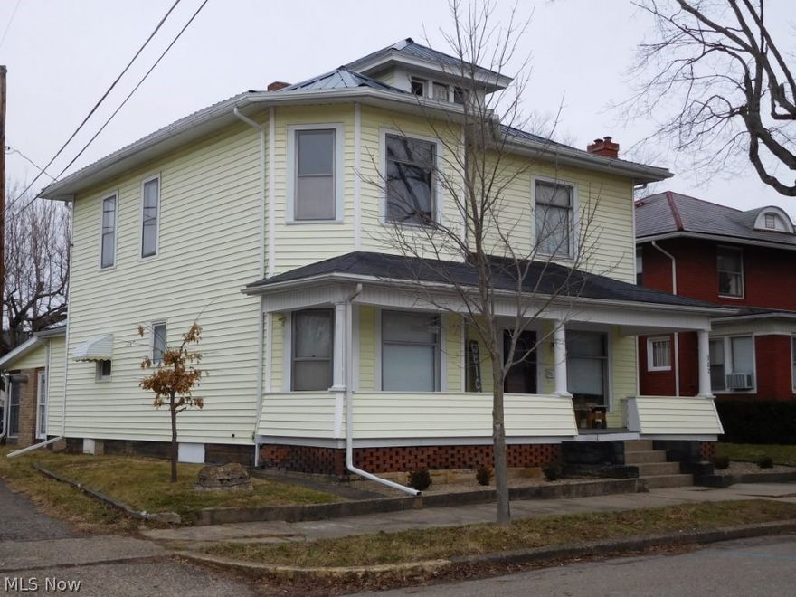 Impressive, stately interior. Beautiful original woodwork, deep baseboards, pocket doors, open oak staircase, beautiful solid paneled doors. Updated, large eat-in kitchen, laminated floors (2 yr), walk-in pantry. New carpet (1 yr). Updated baths, whirlpool tub. Nice 1st floor laundry. Sun room. Great closet space.  200 amp service house and garage. New roof, soffit and spouting 2016 (1 Yr). Security system. 4-car garage/workshop. Walk-up attic. Updated soil pipe.
