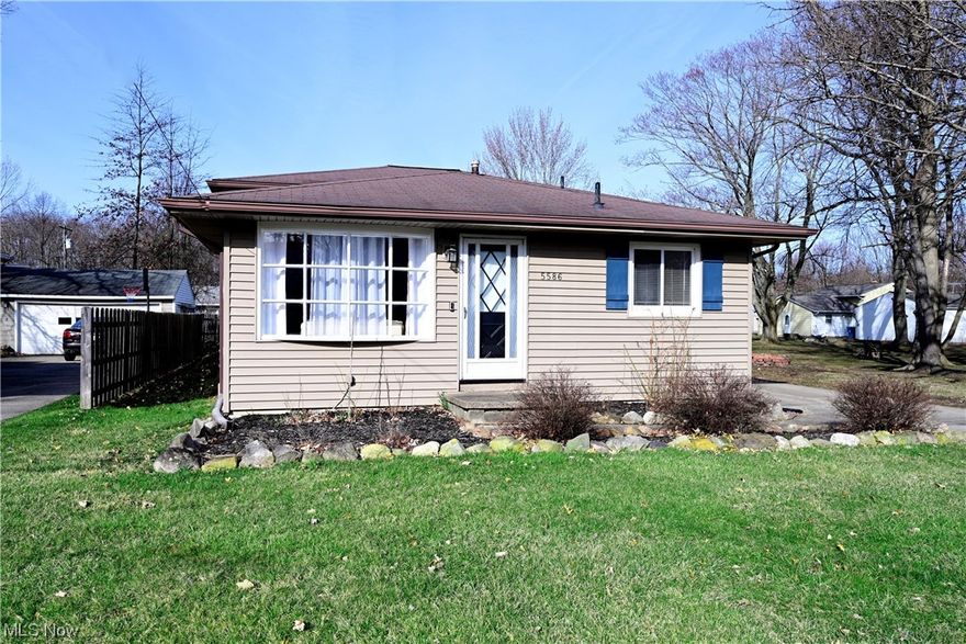 This split level sits on a great lot with mature trees. The kitchen features hickory cabinets and all appliances stay- new stove! Main floor has been painted & remodeled to an open floorplan. Perfect place for gatherings with family & friends. Inside staircases have new vinyl coverings. The lower level is perfect for entertaining. Three additional bedrooms & full bath - with new glass shower door - complete the second floor. Home is move-in ready & has great storage space. Has been waterproofed by previous owner. The home's detached garage is wide enough for two cars plus keeping your outdoor equipment. Close to shopping & schools. Easy access to both I-480 and I-90.