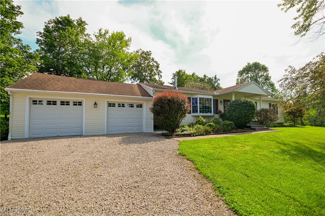 Enjoy peaceful country living at 5131 Wooten Road in Athens, Ohio! This spacious single-story ranch features 3 bedrooms, 2 full bathrooms, and a bright, open layout. You'll love the 22 x 24 family room addition, complete with vaulted ceilings, cozy fireplace, and carpeting for comfort. The front room and hallway to the bedrooms feature laminate wood floors, while the front entry and kitchen/dining areas offer easy-care vinyl flooring-perfect for everyday living; the front room also has a functional wood burning stove. A breezeway connects the house to a 2-car garage, adding convenience while keeping the spaces functional. The home is heated/cooled by four mini-splits. Outside, a versatile outbuilding offers workshop space plus ample room for storage-ideal for mowers, lawn equipment, or even seasonal boat storage.All this sits on 11.3 beautiful acres, giving you space to roam and enjoy the country setting while staying close to the amenities of Athens, including shopping, dining, and entertainment. If you're looking for space, comfort, and flexibility, schedule your showing today!