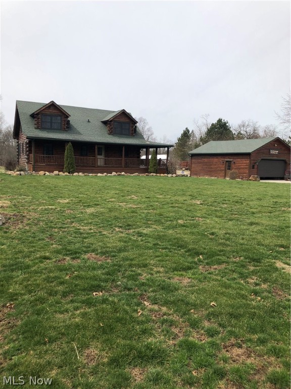 You will fall in love with this Log home built by REAL LOG HOMES. All wood interior with 45 degree angle wood walls and hardwood floors in all rooms except kitchen and baths and laundry. Open concept kitchen/living area with loft overlooking. Kitchen has Granite counter tops. slate floor and Knotty Alder Cabinets. Island has two seats. 2 bedrooms and bath and laundry on first floor. Master bedroom on second floor. Bath with shower and jetted tub..Loft overlooks main floor. Lower level Great/family room is walk out with carpet. Bedroom and bath and 7&15 storage closet. Plumbed for water and drain for bar. Central Vac.
24 by 35 garage/ out building is fake log siding with 220 breaker/50 amp, propane heat and water. Garage could hold more than two cars. Cistern on property but county water is available at road. Almost 3 acres to enjoy. Three quarter Wrap around porch with great view of property which goes about 70 feet into woods.
Septic pump & float replaced 2 yrs. ago. logs-50 yr w