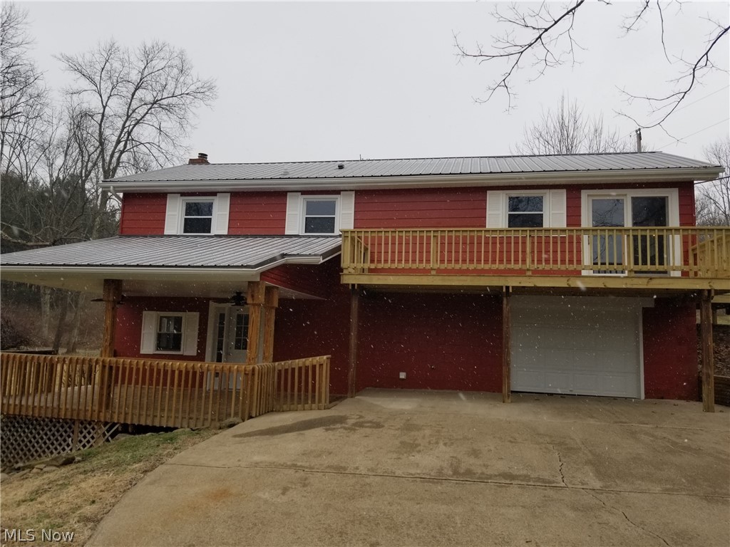 Freshly remodeled three bedroom raised ranch on two acres. Large rec room on lower level with fireplace and walkout to a covered deck for in and outdoor entertaining. Interior updates include complete new bathroom, kitchen, flooring, and lighting. On the outside it received several new decks, steel roof, gutters, doors, and more. New well pump, piping, and wiring. Nice corner lot with woods and creek. Brand new dishwasher, stove, and microwave. Make this cozy home yours. Agent Owned.