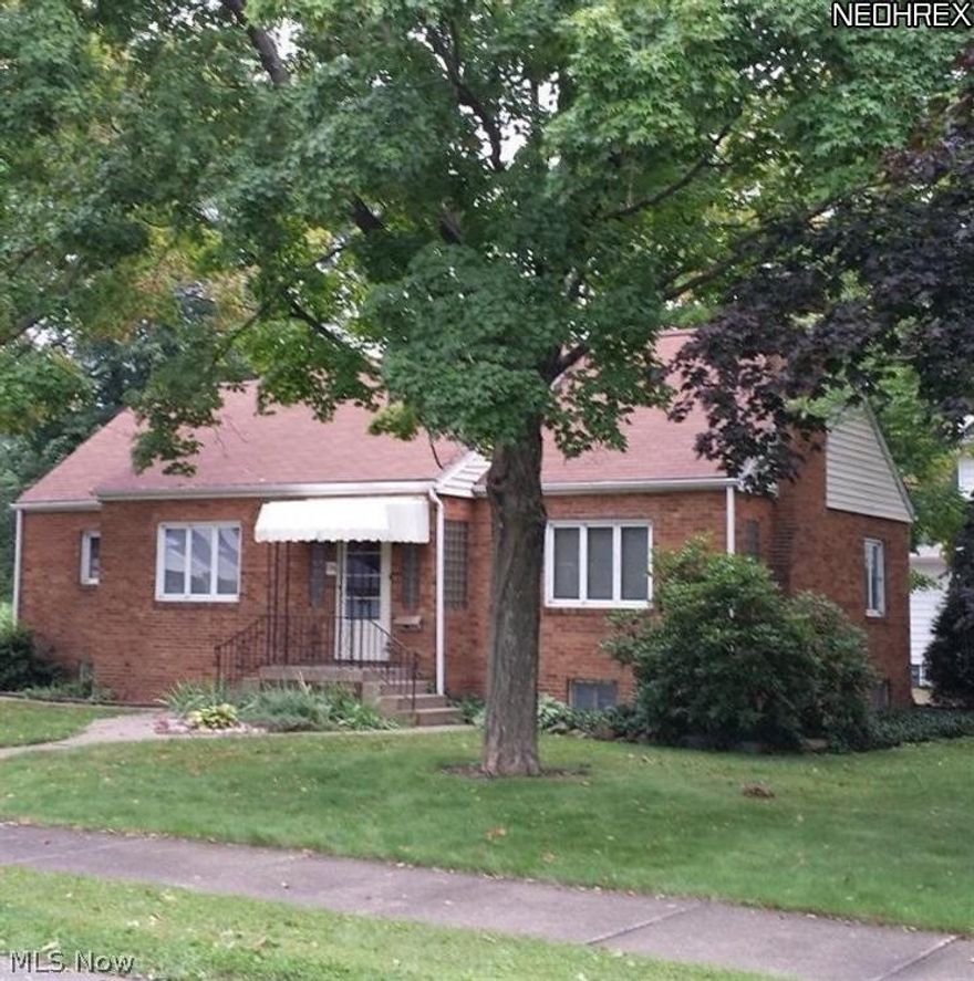 Cozy brick 2 Bedroom bungalow on a quiet corner lot. It's more space than what you'd expect! The living room has a fireplace that just adds more charm to the house. Attached garage. Covered patio area. This is a great location!! Currently rented.