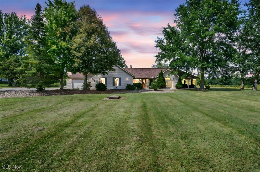 Come home to peace, privacy, and endless possibilities! Spread across 5 sun-soaked acres, this ranch-style home offers tranquil views, fishing at your own pond, and plenty of space to breathe.
Inside, 2,002 sq. ft. of light-filled living space welcomes you with gleaming hardwood floors that lead to an open living room featuring a warm, inviting fireplace. A bright three-season room brings the outdoors in, letting you enjoy every moment surrounded by nature.
Step outside to towering trees that provide soothing shade, or wander through a field of sunflowers that creates a magical backdrop for photos, relaxation, or simply soaking in the scenery.
The updated kitchen shines with new appliances, a peninsula bar with seating for four, and ample cabinet space—perfect for weekday meals or weekend entertaining.
Three bedrooms and three updated bathrooms offer comfort for every member of the household.
For hobbyists or dreamers, a massive 40x60 steel barn with a cement floor is ready for projects or storage, while a 2.5-car garage adds space for ATVs, equipment, or extra vehicles. The home includes a cistern with a water treatment system, yet natural gas and city water are available at the street for added flexibility.
All of this is just minutes from Medina’s shops, dining, and schools, offering the perfect balance of privacy and accessibility for everyday life. Your country dream starts here!