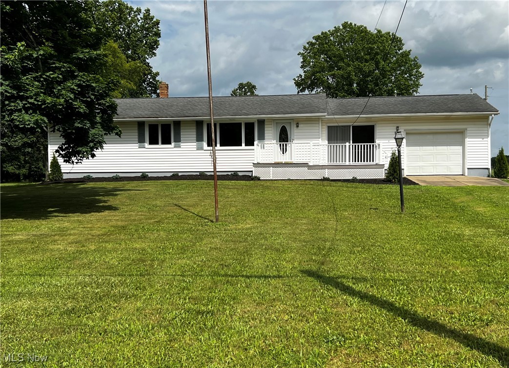 Wishing for the country, look no more this is your perfect country home. A beautiful country view of woods and pastures. This newly remodeled ranch home sitting on 2.057 acres with a 10 x 12 shed and a pole barn 60 x 24. This home is located in Norwayne Local Schools. The home boasts 3 bedrooms, 2 full baths, new kitchen and bathroom cabinets. The kitchen features new corian countertops and brand new stainless steel appliances. Newly tiled bathroom upstairs and brand new bathroom downstairs. New utility room in the basement for the laundry area. The basement has a covered exterior stairwell. Brand new carpet in the living room, hallway, and all 3 bedrooms. Brand new laminate flooring in the dining room, kitchen, entryway, and sun room. The sun room features 4 sliding doors, 4 large sliding windows, and electric baseboard heating for the winter. There is a composite deck on the front and back of home. There is a one car attached garage with electric garage door. The pole barn is concrete flooring including full electric service and water. This barn can be used for animals or a great workshop. There is storage above and a 36 x 8 ft porch. Sellers are offering a one year home warranty. Recently updated pictures to reflect the new kitchen appliances and gravel driveway.