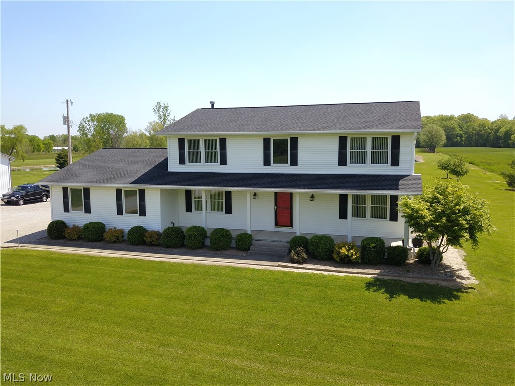Car buffs! Mechanics! Home-based business owners! Collectors! Quick Possession! Classic 3-bedroom colonial on 13.25 manicured acres including beautiful 1.3-acre spring-fed lake, 1.5-2 acres of woods and TWO HUGE OUTBUILDINGS! 44'x40' outbuilding features cement floor, an office & full bath. These areas along with part of the building are heated by Hardy outdoor woodburning furnace (woodburner can also heat the home). Enclosed lift and air compressor stay. 40' x 14' attached covered patio overlooks lake for backyard entertaining. 48' x 80' building also has full cement floor, separate driveway, 3 overhead doors and SO much space for multiple vehicles, RV, ATV, boat, bikes and more! The home features spacious rooms and offers some expensive upgrades: vinyl replacement windows (2 yrs.), new roof was a complete tearoff w/ GAF architectural shingles (4-6 yrs), Anderson sliding patio door in Kitchen (6 yrs). Home comes fully applianced, including washer and dryer. Current owner has
