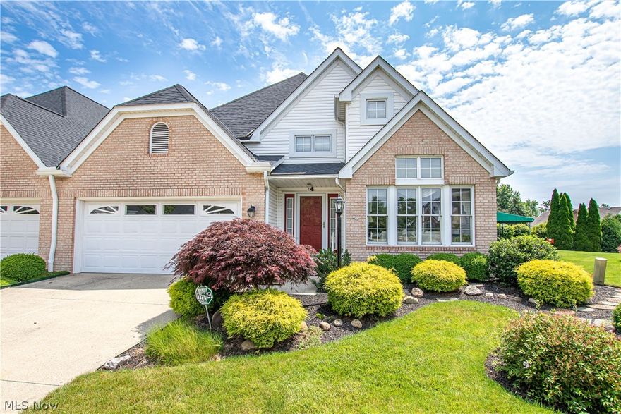 Beautiful one-floor maintenance-free living starts here in this stunningly appointed cluster home in Rocky River! This home's lush landscaping invites you into the light-filled entryway with soaring ceilings and neutral colors throughout. Ceramic tile floors lead you into the oversized two-car garage featuring gorgeous nature stone flooring and plentiful storage space. Inside the home, the formal living room and dining room are open to one another making entertaining a breeze. Down the hallway, you will find a butler's pantry featuring a wet bar, solid wood cabinets, and additional countertop space and utility closet. The kitchen features laminate flooring with a plethora of cabinet and countertop space and even an eat-in nook opened to this home's additional family room. The family room is anchored by a warm and cozy gas fireplace and boasts vaulted ceilings. An additional flex space is located in this home's four-season room with a door out to an awning-covered patio overlooking tons