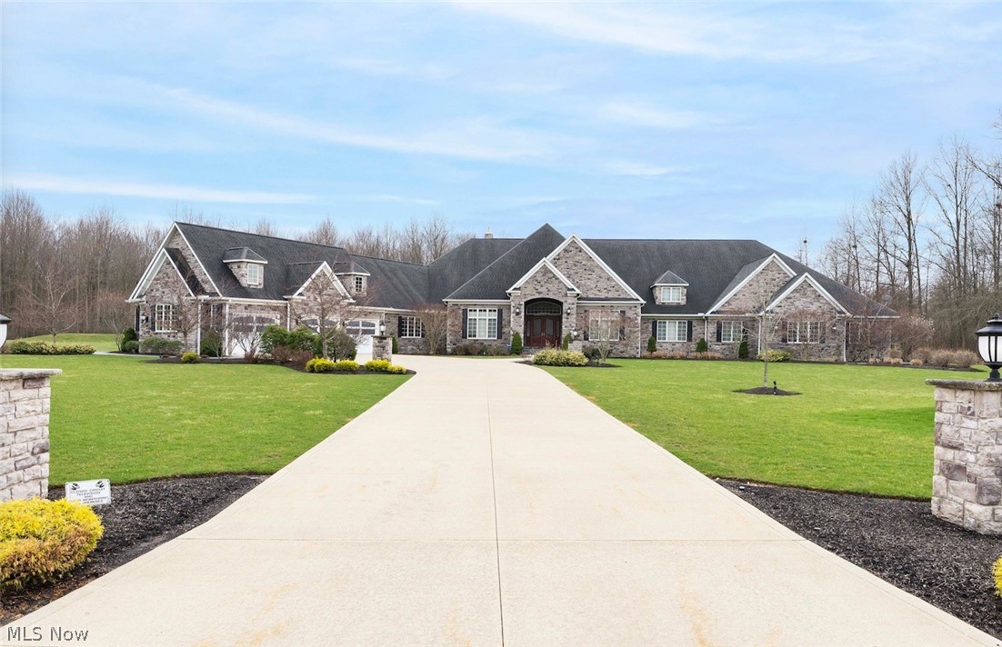 Prepare to be wowed by this one of a kind sprawling ranch estate located on prime wooded cul-de-sac lot. This masterpiece offers all the finest amenities and appointments. Just over 10,000k in square footage the main attractions are the open concept floor plan, first floor primary retreat, state of the art home theatre/golf simulator, gourmet eat in kitchen, full finished lower level with bar, entertainment area, custom walk in closet. No need to leave home the backyard oasis includes outdoor kitchen, swimming pool with waterfalls and slide, custom dog kennels and personalized gym. Homeowner spared no expense building an Ophora water shed and system for optimal bathing and drinking water for the whole home. Truly a rare find and amazing opportunity to live in one of Northeast Ohios iconic properties.