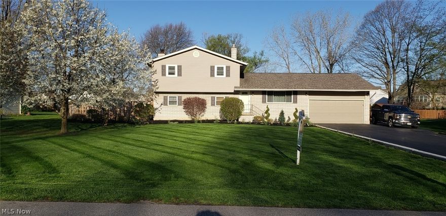 Beautiful completely remodeled 4 bedroom 2 full bath 2,235 SF Split Level home in Mentor situated on ½ acre lot. This home has it all! Spacious living room leads into eat in kitchen that has been custom made that features all wood cabinetry with self closing doors and drawers, Quartz countertop, stainless steel appliances, new range with gas cooking and electric double range. Extra built in oven. Flooring throughout the whole house is “Lifeproof” laminate. Master bedroom with large walk in closet with ceiling to floor wall organizer. Private master bath with dual vanities and jetted tub. 3 other spacious bedrooms. 2 car attached garage and a 1 car detached garage/workshop. Completely fenced in back yard with a separate fenced vegetable garden. An apple tree and 2 cherry trees greet you as you pull into the drive. Newer items include Roof, siding, windows, and gutters. Asphalt driveway 2016 and sealcoated 2017. Added in 2018 16KW gas generator automatically set to turn on in case of pow