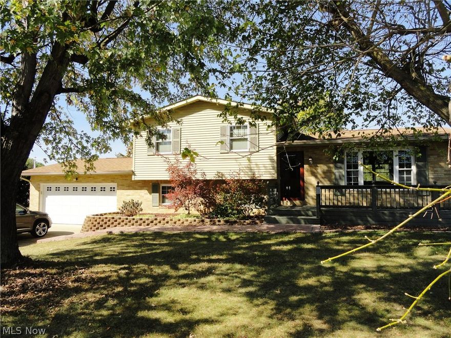 Welcome to your country getaway situated on 2 level acres in a well established neighborhood.  3-4 BR's 2 Baths, Fully equipped oak kitchen w/attractive laminate floor, formal DR & LR.  Covered back patio + front deck.  2 car attached + detached garage w/front & side entry.  Newer roof in 2015, 200 amp service in 2012, updated vinyl windows, public water (not currently in use) & well. Minutes from PA/OH state line.  Close to the Beaver County/Shell Cracker Plant w/the advantage of low WV property taxes.