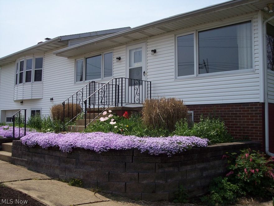 Main floor features a great room with fireplace and beautiful views.  Lower level has walk out entrance and full kitchen and living area.  Possible 3 bedrooms or would make a home office.  Great rural location just minutes south of US Rt 30.
