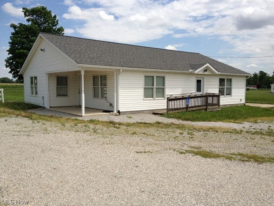 Many possibilities with this property. 10+ acres with pond 4 outbuildings and newer built ranch style handicap accessible home on a slab. The ranch home was previously used as offices but truly has 2 bedrooms, living room, eat in kitchen and full bath. The outbuildings range from 30x20, 30x30, and 24x22. A few of the buildings need a little work but others are in great condition. The land has wooded area, pond and large parking lot. You could use this as a personal residence or some type of business very easily. Call to take a look and see what use you may have for this property. Electric is metered separate for buildings. Security System in place.