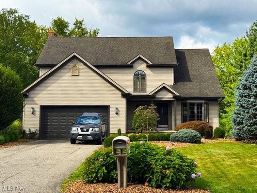 Welcome to this spacious 4-5 bedroom, 2.5 story home featuring vaulted ceilings throughout. Walk in to the front foyer to the living room with vaulted ceiling. Proceed to the formal dining room leading to a large eat-in kitchen with all appliances. The open floor plan continues to the great room with fireplace. Both kitchen and great room have double doors leading to the private deck, which overlooks the beauty of the back yard creek and woods. Convenient half bath also on the 1st floor. The 2nd floor features 4 bedrooms and 2 full bathrooms. The Master Bedroom has walk-in closet, dressing area, full bath w/double sinks and above garage storage access. The lower, walk-out level has a possible 5th bedroom/office plus storage areas. This cozy space also has a ceramic tiled wet bar w/built-in refrigerator in the large rec room. Double doors open to a concrete, covered patio facing the back yard retreat-like setting, perfect for entertaining or relaxing with family and friends. This home has so much to offer to enjoy a future full of fun! Call today to see.