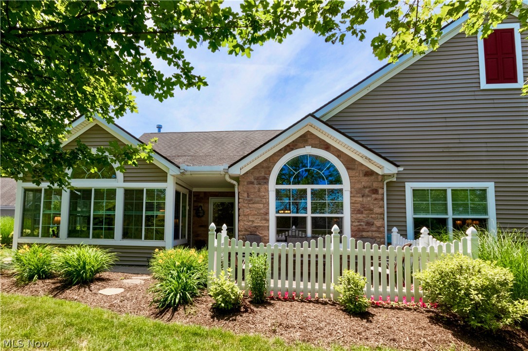 Home Sweet Waterside Home! Move right into this gorgeously-kept original-owner Kent, Ohio 2/3 Bedroom Condo that you will be proud to call HOME! Situated near Rt 261, you'll find your community of enjoyment w/ clubhouse that's complete w/ a full kitchen, fireplace, billiards, workout facility and outdoor adjacent pool. Amazing view of Golden Pond from the perfectly-situated patio on this Premium Lot Unit! Beautiful maple kitchen (all appliances stay) w/ LVT, granite countertops. Living room boasts gas fireplace & beautiful Palladian window, with abundant natural light! The library/music/work-from-home room, also w/ a Palladian and north-facing view of the water, can be used as a Bedroom 3 w/ slight modifications . Gorgeous waterside 4-season room...a great place for a book or cup of coffee. Master w/ ensuite bath is spacious, boasting walk-in closet. Fans installed in rooms to aid in summer comfort. Pull-down garage storage. Mechanicals closet at front of garage instead of absorbing i
