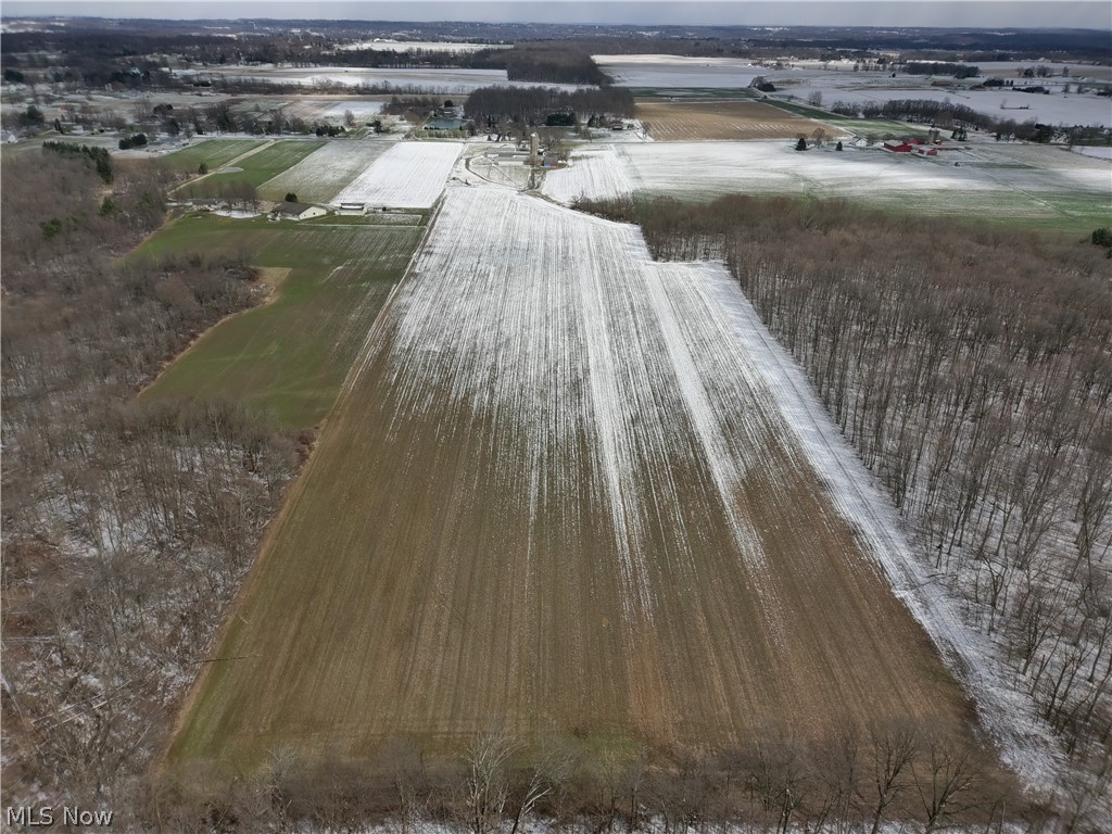 5.2+/- Acres of vacant ground with approx.. 255 ft of road frontage. Excellent building lot or farm ground.