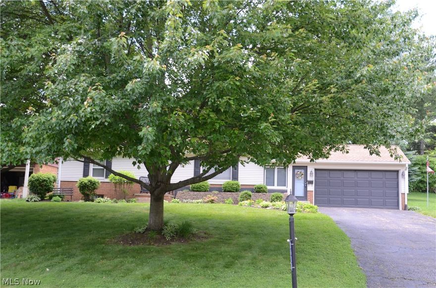 Location, Location, location.....Near the Soon to Be Finished HOF Village !!   Low maintenance home. Newer windows, Hard wood floors ...Finished Rec Room ...Updated electric...Security System, Enclosed Breezeway with Fireplace!!