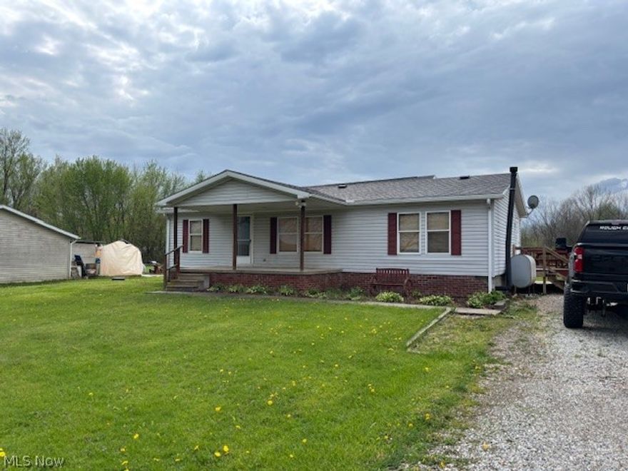 Great country location. 3-bedroom and 2-bath home on over 6 acres. Home features a spacious back deck for entertaining.  The property also has an oversized heated garage. Home is being sold as-is.