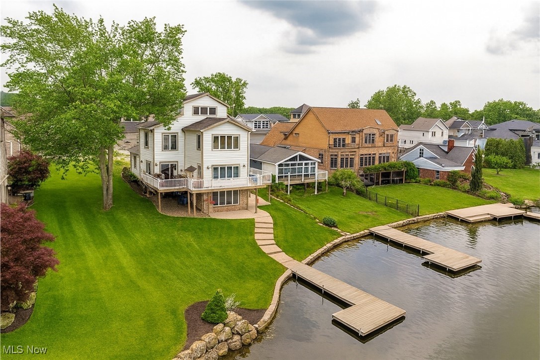 Live the Lake Life for a Remarkable Value!
Now is your chance to call prestigious Lake Cable home at a new, more attractive price. This 3-story, 3-bedroom, 3.5-bath waterfront residence delivers a lifestyle that many dream of — at a value that makes it even more attainable. Wake up to sweeping water views and morning sun on one of the most desirable stretches of Lake Cable. The main level showcases soaring cathedral ceilings, hardwood floors, a spacious great room with gas fireplace, and a chef’s kitchen with white cabinetry, granite countertops, and stainless-steel appliances. Entertain with ease thanks to the wet bar, expansive dining area, and large deck overlooking the lake. The primary suite is a retreat of its own, featuring a cozy fireplace, spa-like bath with heated tile floors and sauna shower, plus a generous walk-in closet. The third-floor suite offers privacy and stunning views, while the flexible main-floor office (with custom furniture included) could easily serve as a den or extra bedroom. The walk-out lower level adds another layer of living space with a fireplace, full bath, large bedroom, storage, and direct access to your spacious lakefront lot and private dock. Additional highlights include a 2-car garage with epoxy-coated flooring, central vacuum, radon mitigation, security system, day/night shades, and a laundry room with nearly new appliances. As part of the Lake Cable Recreation Association, enjoy access to the clubhouse, marina, boating, and fireworks displays — the ultimate in lake living. ? A beautiful pontoon boat is also available for purchase separately at $18,000. This is your opportunity to live the Lake Cable lifestyle — comfort, prestige, and value all in one.