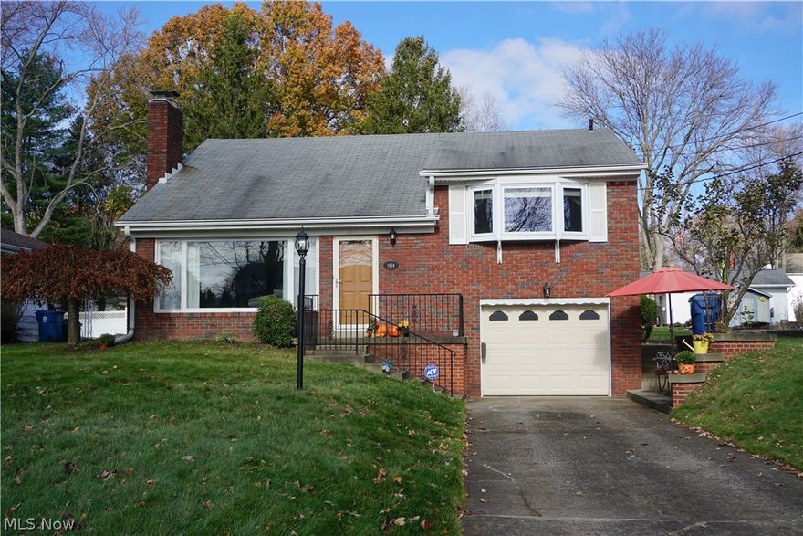 Pack your bags and get ready to MOVE!  You'll fall in love with this gorgeous all BRICK  unique split level home. Updated kitchen has an awesome bay window, letting in an abundance of natural light, oak cabinets, ceramic tile floor,  pantry, and a  stove, dishwasher, microwave, and dishwasher that all stay.  Large formal dining room with hardwood floors, overlooks the living room, also with hardwood floors, newer gas fireplace, and 11.5 ft ceilings.  The master bedroom easily accommodates a king size bed and has a triple closet and remote controlled "black-out" blinds. The other 2 bedrooms each have double closets and all 3 have hardwood floors.  Full bath.  On the lower level is a large family room with outside access, laundry room with sink, and a brand new full bath with a step-in shower.   1.5 car garage offers extra storage and houses the water softener. Other updates include: vinyl replacement windows, glass block windows, leaf guard on the gutters with a life time warranty, upda
