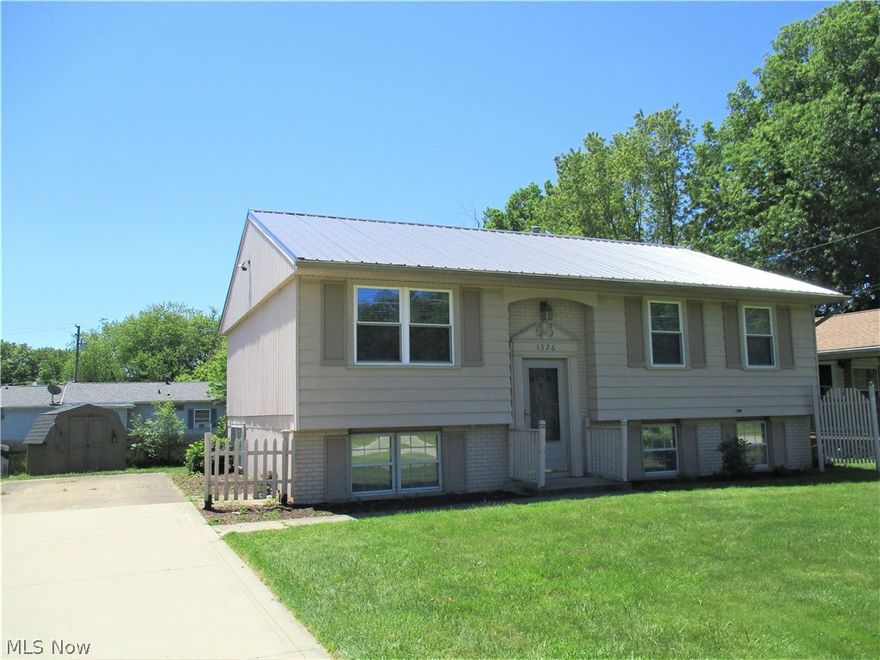 What a nice home.  3-bedroom, 1-bath bi-level with a full basement waiting to be finished.  Home features beautiful living room laminate flooring, vinyl tile in the kitchen and bath.  New metal roof 10/2016, Windows were updated in 2008, gas forced air furnace and central air installed by Zieglar's in 2003,  Extra wide concrete driveway.  Out back find a nice privacy fenced back yard and a storage shed. It wouldn't take much to fully fence the back yard for pets or children.  Extra wide concrete driveway.  Kitchen fridge, gas range, washer and dryer stay with the home.  Kitchen features under cabinet lighting too. 12-month America's Preferred Home Warranty is included with the sale!  This one is ready for the next owner!