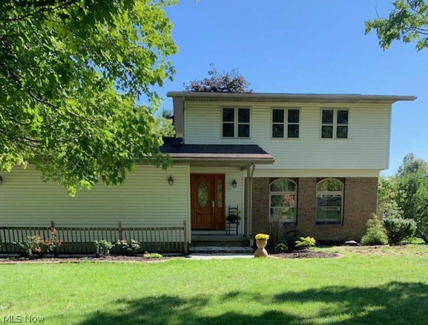 Come and see this newly renovated home!  Spacious yard all around the house with a wonderful, large deck.  Living room opens into the dining room with large french doors.  All appliances stay with a brand-new cooktop range and hood.  Lovely sliding doors that lead to the large deck from the family room.  On the second floor there's a half bath connected to the full bath for everyone to use.  The master bedroom boasts a balcony that overlooks the backyard and deck.  This house is A MUST SEE, come and make it your own.