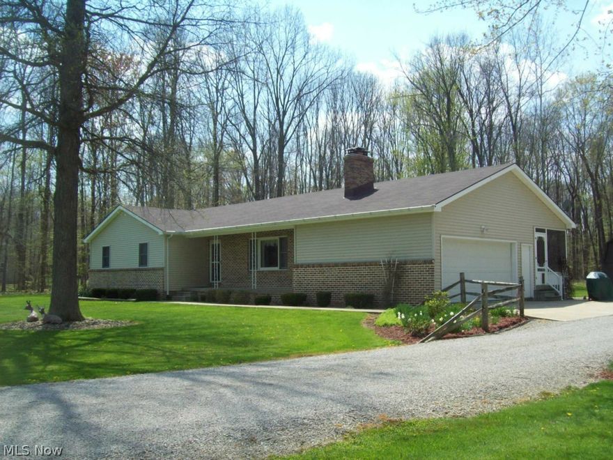 Rural,wooded ,scenic and a very quiet area describe the location of this beautiful ranch home on 5.7  wooded acres truly a must to view. The fabulous home built by the owner was exceptionally well built with a brick wood burning fireplace, granite counter tops, partial brick front, full basement, covered front porch and many more upgrades through out the home. The house has been maintained amazingly well and shows like a new home. The enclosed patio in the rear of the home looks over the most beautiful wooded back grounds abundant with wild life and is a great place to relax. The 26x40 work shop-pole barn has 100 amp service .electric ,water, concrete floor and is a great place for working on all your hobbies a must to see and is a real man cave. The other  14x16 storage barn with electric adds even more storage areas.  There is also a wood burner hook up in the basement and all appliances stay in the home. Dont miss out on one of the nicest homes in Southern Lorain County. Armstrong f