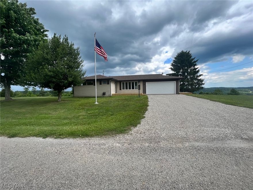 Offering a view you can see for miles!!! This beautiful ranch home sits on top of 4.3 acres overlooking Washington County. Current owners have done fresh paint 
though out, turned the family room back into the garage, new roof May 2023. Enjoy the country living in this 3-bedroom 1.5 bath home, just minutes away from town. Home offers original, beautiful oak flooring throughout.  The eat-in kitchen offers custom hickory cabinets with abundance of storage and walks you out French doors to your back covered porch.  The partially finished, walkout basement offers a family room that could be used for a recreation room or even a 4th bedroom option. The detached oversized garage (24x40) offers room for 2 plus cars and a fantastic workshop area. This garage also offers a wood burning stove and a work bench area. On the property you will find a natural spring that attracts all types of wildlife!! Home is all electric but there is natural gas available across the road, all the neighbors are hoo